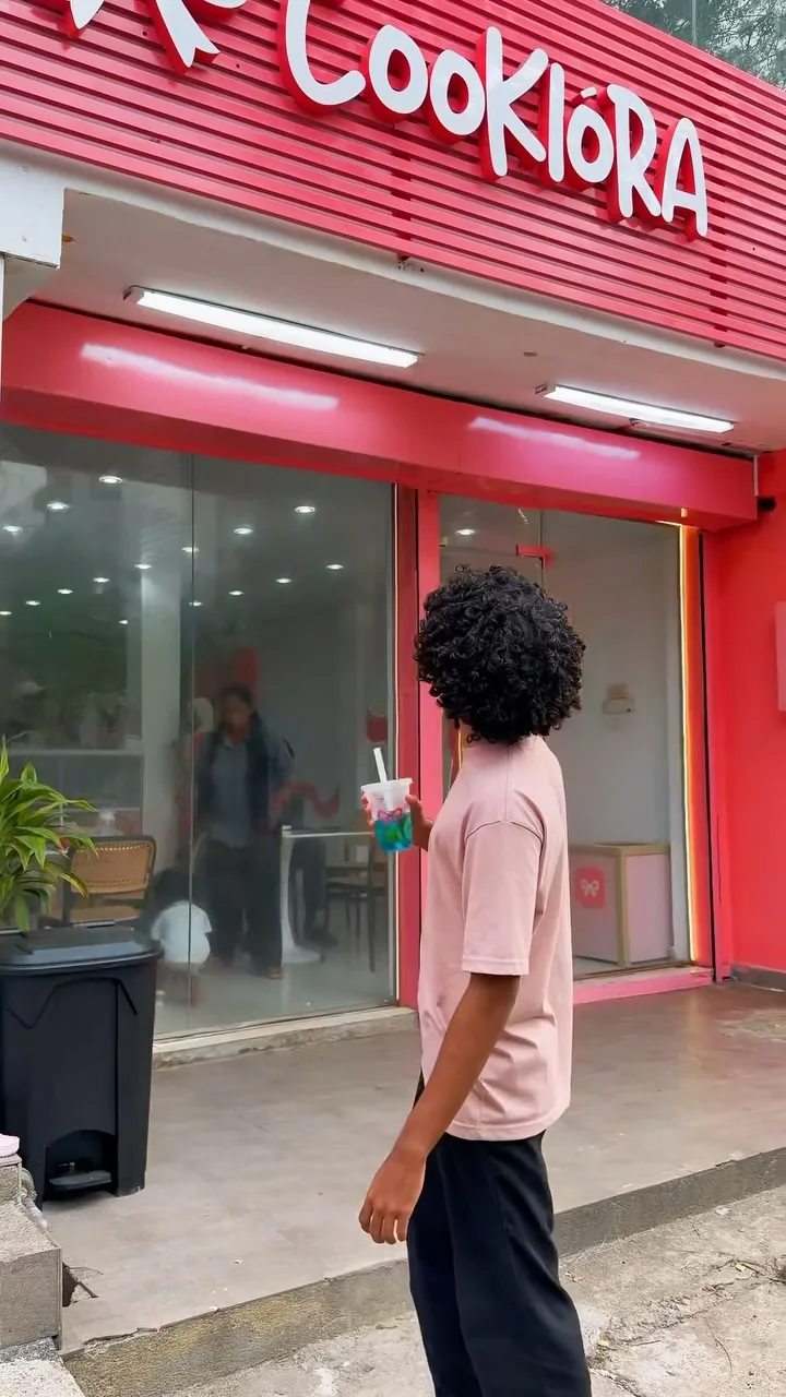 A visitor walking up to the Cookiora shopfront